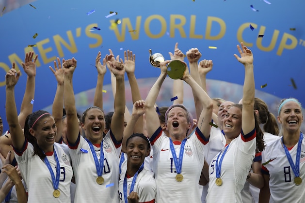 United States' Megan Rapinoe lifts up a trophy after winning the Women's World Cup final soccer match between US and The Netherlands at the Stade de Lyon in Decines, outside Lyon, France, Sunday, July 7, 2019. (AP Photo/Alessandra Tarantino)