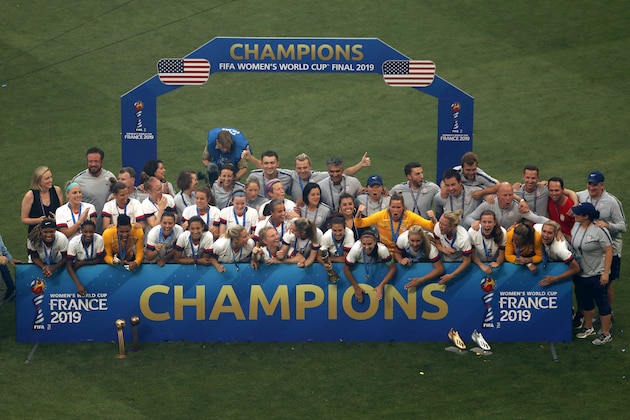 LYON, FRANCE - JULY 07:  Carli Lloyd of the USA and teammates pose with the FIFA Women's World Cup Trophy following their team's victory in the 2019 FIFA Women's World Cup France Final match between The United States of America and The Netherlands at Stade de Lyon on July 07, 2019 in Lyon, France. (Photo by Robert Cianflone/Getty Images)
