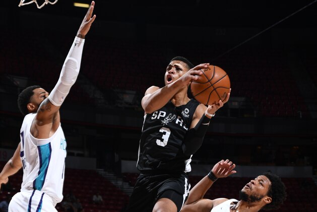 DENVER, CO - JULY 7: Keldon Johnson #3 of the San Antonio Spurs drives to the basket for shot against the Charlotte Hornets during Day 3 of the 2019 Las Vegas Summer League on July 7, 2019 at the Thomas & Mack Center in Las Vegas, Nevada. NOTE TO USER: User expressly acknowledges and agrees that, by downloading and/or using this Photograph, user is consenting to the terms and conditions of the Getty Images License Agreement. Mandatory Copyright Notice: Copyright 2019 NBAE (Photo by Garrett Ellwood/NBAE via Getty Images)