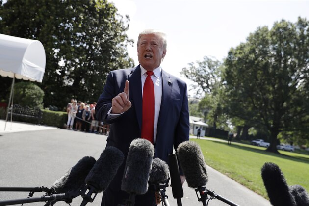 President Donald Trump talks to reporters on the South Lawn of the White House before departing for his Bedminster, N.J. golf club, Friday, July 5, 2019, in Washington. (AP Photo/Evan Vucci)
