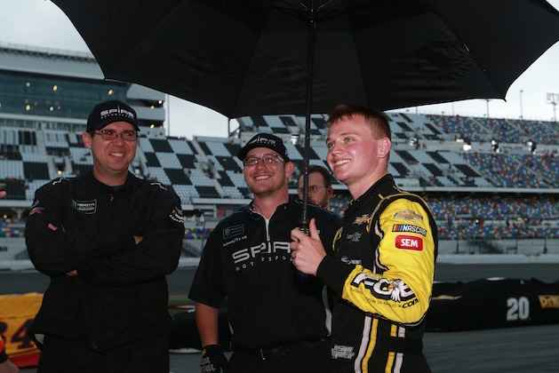 DAYTONA BEACH, FLORIDA - JULY 07: Justin Haley, driver of the #77 Fraternal Order of Eagles Chevrolet, talks with his crew during a weather delay for the Monster Energy NASCAR Cup Series Coke Zero Sugar 400 at Daytona International Speedway on July 07, 2019 in Daytona Beach, Florida. (Photo by Sean Gardner/Getty Images)