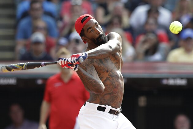 J.R. Smith hits during the All Star MLB Celebrity Softball game, Sunday, July 7, 2019, in Cleveland. The 90th MLB baseball All-Star Game will be played Tuesday. (AP Photo/Tony Dejak)