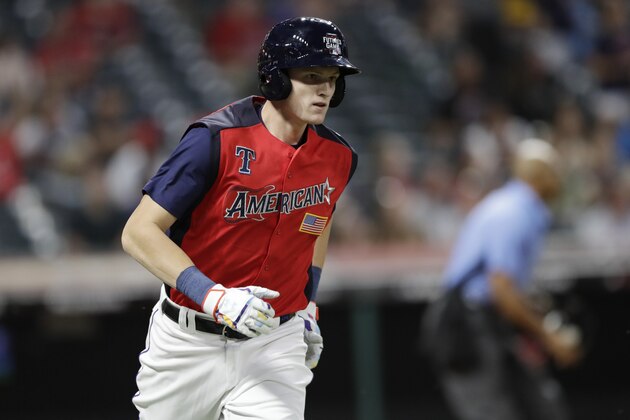 Sam Huff, of the Texas Rangers, runs after hitting a two-run home run during the seventh inning of the MLB All-Star Futures baseball game, Sunday, July 7, 2019, in Cleveland. The MLB baseball All-Star Game is to be played Tuesday. (AP Photo/Tony Dejak)