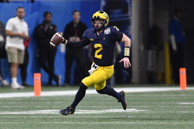 Michigan quarterback Shea Patterson (2) runs against Florida during the first half of the Peach Bowl NCAA college football game, Saturday, Dec. 29, 2018, in Atlanta. (AP Photo/Mike Stewart)