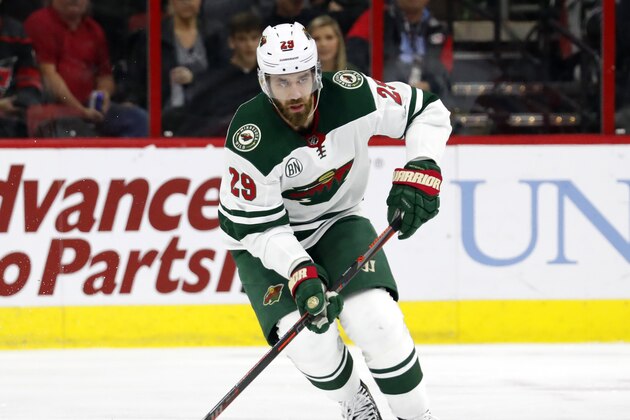 Minnesota Wild's Greg Pateryn (29) moves the puck during the first period of an NHL hockey game, Saturday, March 23, 2019, in Raleigh, N.C. (AP Photo/Karl B DeBlaker)