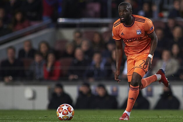 BARCELONA, SPAIN - MARCH 13: Tanguy Ndombele of Olympique Lyonnais runs with the ball during the UEFA Champions League Round of 16 Second Leg match between FC Barcelona and Olympique Lyonnais at Nou Camp on March 13, 2019 in Barcelona, Spain. (Photo by Quality Sport Images/Getty Images)