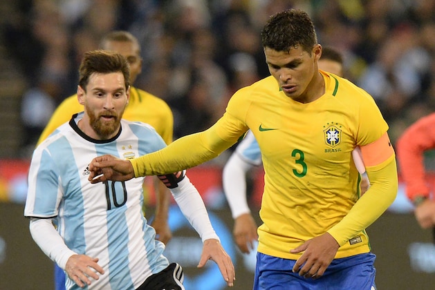 Agentinas Lionel Messi (L) chases Brazilian Thiago Silva during their friendly international football match between Brazil and Argentina at the MCG in Melbourne on June 9, 2017. / AFP PHOTO / Mal Fairclough / IMAGE RESTRICTED TO EDITORIAL USE - STRICTLY NO COMMERCIAL USE        (Photo credit should read MAL FAIRCLOUGH/AFP/Getty Images)