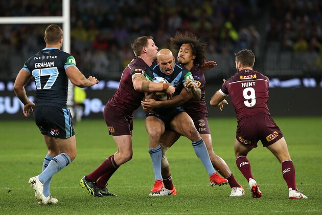 PERTH, AUSTRALIA - JUNE 23: Blake Ferguson of New South Wales gets tackled by Jarrod Wallace and Felise Kaufusi of Queensland during game two of the 2019 State of Origin series between the New South Wales Blues and the Queensland Maroons at Optus Stadium on June 23, 2019 in Perth, Australia. (Photo by Paul Kane/Getty Images)