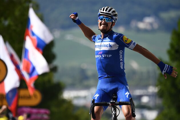 French rider Julian Alaphilippe celebrates his victory as he crosses the finish line of the third stage of the 106th edition of the Tour de France cycling race between Binche and Epernay, in Reims on July 8, 2019. (Photo by Anne-Christine POUJOULAT / AFP)        (Photo credit should read ANNE-CHRISTINE POUJOULAT/AFP/Getty Images)