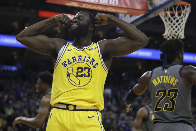 Golden State Warriors' Draymond Green, left, celebrates a score against the Indiana Pacers during the second half of an NBA basketball game Thursday, March 21, 2019, in Oakland, Calif. (AP Photo/Ben Margot)