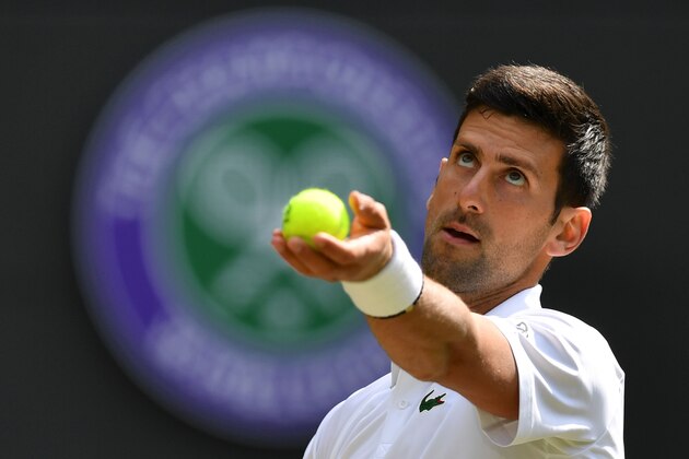 Serbia's Novak Djokovic serves against France's Ugo Humbert during their men's singles fourth round match on the seventh day of the 2019 Wimbledon Championships at The All England Lawn Tennis Club in Wimbledon, southwest London, on July 8, 2019. (Photo by GLYN KIRK / AFP) / RESTRICTED TO EDITORIAL USE        (Photo credit should read GLYN KIRK/AFP/Getty Images)