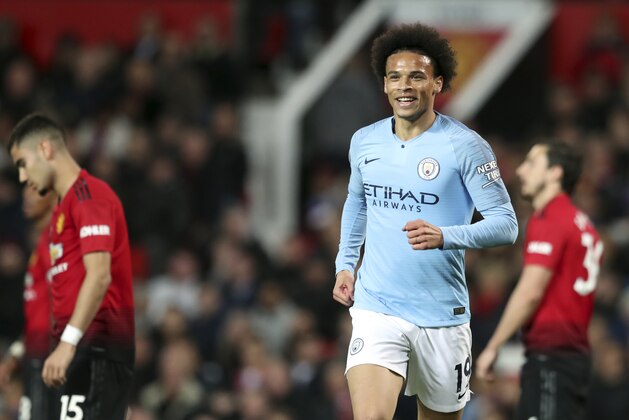 Manchester City's Leroy Sane celebrates after scoring his side's second goal during the English Premier League soccer match between Manchester United and Manchester City at Old Trafford Stadium in Manchester, England, Wednesday April 24, 2019. (AP Photo/Jon Super)