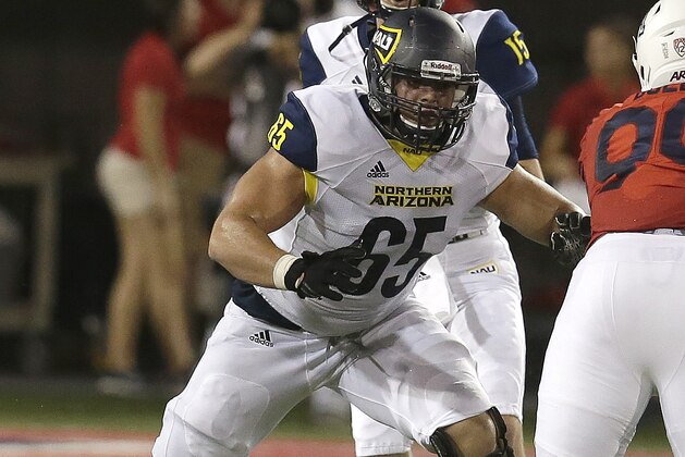 Northern Arizona offensive lineman Malik Noshi (65) in the first half during an NCAA college football game against Arizona, Saturday, Sept. 2, 2017, in Tucson, Ariz. (AP Photo/Rick Scuteri)