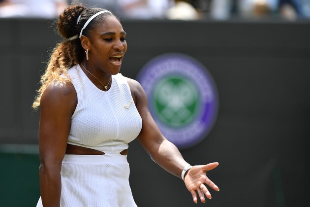 US player Serena Williams reacts during a point against Spain's Carla Suarez Navarro during their women's singles fourth round match on the seventh day of the 2019 Wimbledon Championships at The All England Lawn Tennis Club in Wimbledon, southwest London, on July 8, 2019. (Photo by GLYN KIRK / AFP) / RESTRICTED TO EDITORIAL USE        (Photo credit should read GLYN KIRK/AFP/Getty Images)
