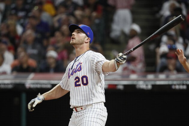 Pete Alonso, of the New York Mets, watches his hit during the Major League Baseball Home Run Derby, Monday, July 8, 2019, in Cleveland. The MLB baseball All-Star Game will be played Tuesday. (AP Photo/John Minchillo)