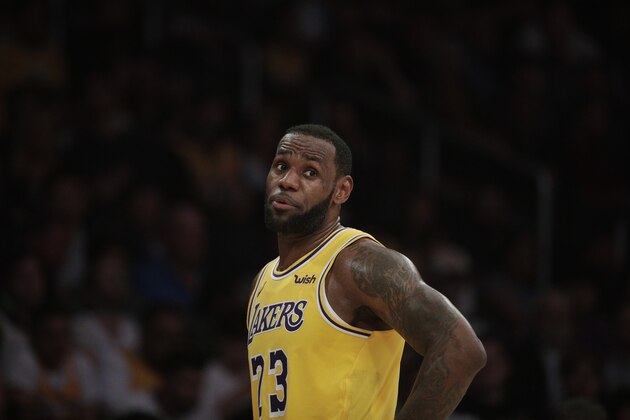 Los Angeles Lakers' LeBron James talks to his teammate during the second half of an NBA basketball game against the Washington Wizards, Tuesday, March 26, 2019, in Los Angeles. The Lakers won 124-106. (AP Photo/Jae C. Hong)