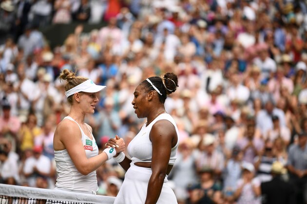US player Serena Williams (R) shakes hands with US player Alison Riske (L) over the net after Williams won their women's singles quarter-final match on day eight of the 2019 Wimbledon Championships at The All England Lawn Tennis Club in Wimbledon, southwest London, on July 9, 2019. (Photo by Daniel LEAL-OLIVAS / AFP) / RESTRICTED TO EDITORIAL USE        (Photo credit should read DANIEL LEAL-OLIVAS/AFP/Getty Images)