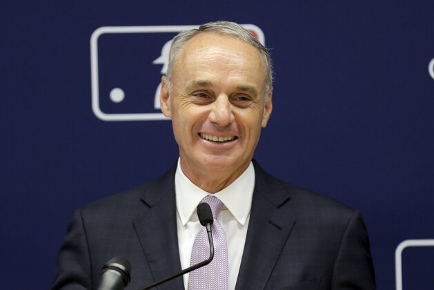 Major League Baseball commissioner Rob Manfred speaks to reporters after a meeting of baseball team owners in New York, Thursday, June 20, 2019. The Tampa Bay Rays have received permission from Major League Baseball's executive council to explore a plan that could see the team split its home games between the Tampa Bay area and Montreal, reports said Thursday. (AP Photo/Seth Wenig)
