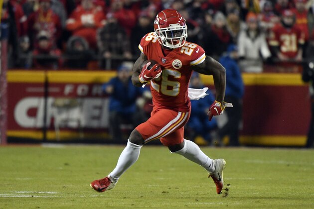 Kansas City Chiefs running back Damien Williams (26) carries the ball during the first half of an NFL football game against the Los Angeles Chargers in Kansas City, Mo., Thursday, Dec. 13, 2018. (AP Photo/Ed Zurga)