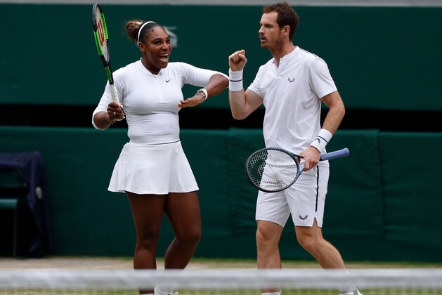Britain's Andy Murray (R) and US player Serena Williams (L) celebrate winning a point against France's Fabrice Martin and US player Raquel Atawo during their mixed doubles second round match on day eight of the 2019 Wimbledon Championships at The All England Lawn Tennis Club in Wimbledon, southwest London, on July 9, 2019. (Photo by Adrian DENNIS / AFP) / RESTRICTED TO EDITORIAL USE        (Photo credit should read ADRIAN DENNIS/AFP/Getty Images)