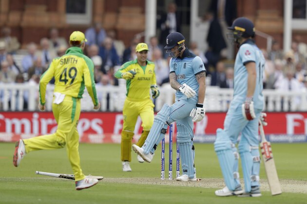 England's Ben Stokes kicks his bat away as he reacts in frustration after being bowled out by a yorker from Australia's Mitchell Starc during the Cricket World Cup match between England and Australia at Lord's cricket ground in London, Tuesday, June 25, 2019. (AP Photo/Matt Dunham)