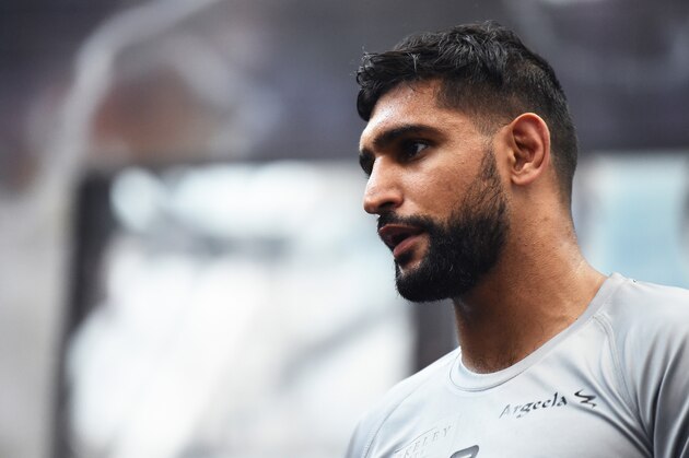 BOLTON, ENGLAND - JUNE 19:  Amir Khan looks on as he takes part during a training session at Amir Khan Academy on June 19, 2019 in Bolton, England. (Photo by Nathan Stirk/Getty Images)