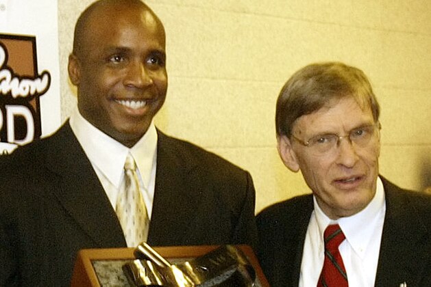 ** FILE ** San Francisco Giants' Barry Bonds, left, holds the National League Hank Aaron award with Commissioner Bud Selig, right, during a ceremony before Game 4 of the World Series in this Oct. 27, 2004 photo in St. Louis.  (AP Photo/James Finley)