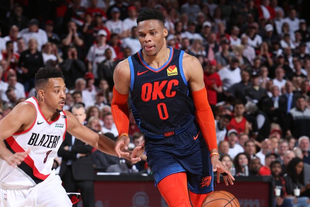 PORTLAND, OR - APRIL 23:  Russell Westbrook #0 of the Oklahoma City Thunder handles the ball against CJ McCollum #3 of the Portland Trail Blazers during Game Five Round One of the 2019 NBA Playoffs on April 23, 2019 at the Moda Center in Portland, Oregon. NOTE TO USER: User expressly acknowledges and agrees that, by downloading and or using this Photograph, user is consenting to the terms and conditions of the Getty Images License Agreement. Mandatory Copyright Notice: Copyright 2019 NBAE (Photo by Sam Forencich/NBAE via Getty Images)