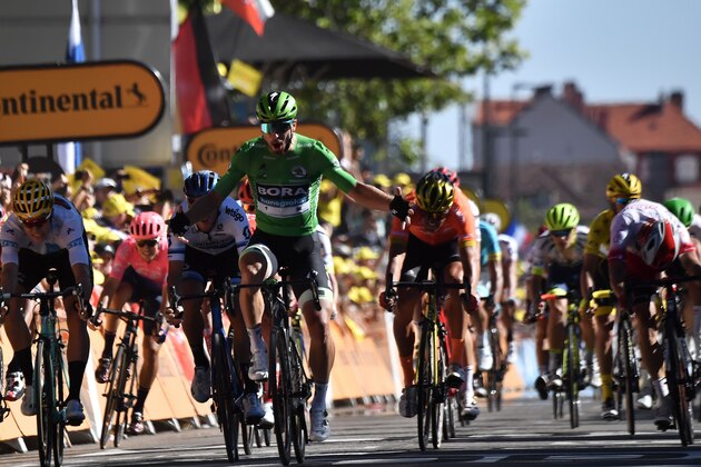 Slovakia's Peter Sagan (2ndL), wearing the best sprinter's green jersey celebrates as he wins on the finish line of the fifth stage of the 106th edition of the Tour de France cycling race between Saint-Die-des-Vosges and Colmar, eastern France, in Colmar on July 10, 2019. (Photo by JEFF PACHOUD / AFP)        (Photo credit should read JEFF PACHOUD/AFP/Getty Images)