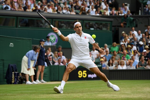 LONDON, ENGLAND - JULY 10: Roger Federer of Switzerland plays a forehand in his Men's Singles Quarter Final match against Kei Nishikori of Japan during Day Nine of The Championships - Wimbledon 2019 at All England Lawn Tennis and Croquet Club on July 10, 2019 in London, England. (Photo by Mike Hewitt/Getty Images)