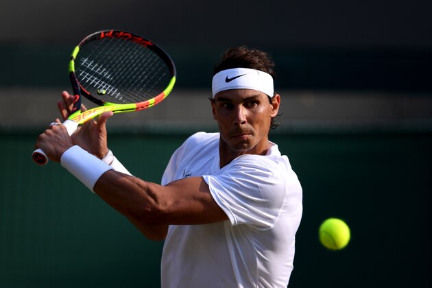 LONDON, ENGLAND - JULY 10: Rafael Nadal of Spain plays a backhand in his Men's Singles Quarter Final match against Sam Querrey of the United States during Day Nine of The Championships - Wimbledon 2019 at All England Lawn Tennis and Croquet Club on July 10, 2019 in London, England. (Photo by Laurence Griffiths/Getty Images)