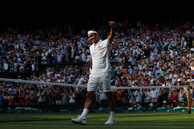 Switzerland's Roger Federer celebrates beating Japan's Kei Nishikori during their men's singles quarter-final match on day nine of the 2019 Wimbledon Championships at The All England Lawn Tennis Club in Wimbledon, southwest London, on July 10, 2019. (Photo by Adrian DENNIS / AFP) / RESTRICTED TO EDITORIAL USE        (Photo credit should read ADRIAN DENNIS/AFP/Getty Images)