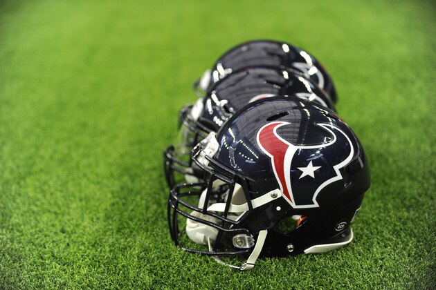 Houston Texans helmets sit on the field before an NFL football game against the Indianapolis Colts Sunday, Dec. 9, 2018, in Houston. (AP Photo/Eric Christian Smith)