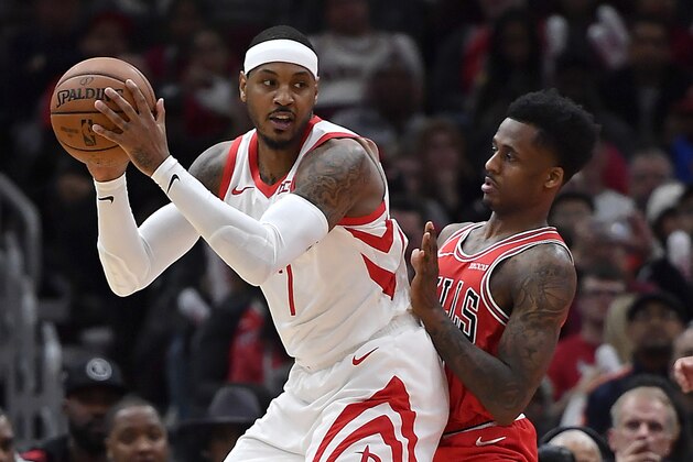 CHICAGO, ILLINOIS - NOVEMBER 03: Carmelo Anthony #7 of the Houston Rockets takes on Antonio Blakeney #9 of the Chicago Bulls at United Center on November 03, 2018 in Chicago, Illinois.  NOTE TO USER: User expressly acknowledges and agrees that, by downloading and or using this photograph, User is consenting to the terms and conditions of the Getty Images License Agreement.  (Photo by Quinn Harris/Getty Images)
