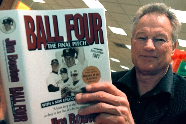 382468 01: Former New York Yankees pitcher Jim Bouton signs copies of his new book,