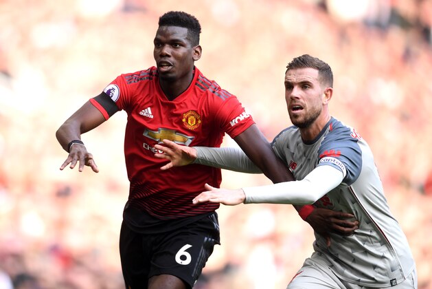 MANCHESTER, ENGLAND - FEBRUARY 24:  Paul Pogba of Manchester United and Jordan Henderson of Liverpool look on during the Premier League match between Manchester United and Liverpool FC at Old Trafford on February 24, 2019 in Manchester, United Kingdom.  (Photo by Laurence Griffiths/Getty Images)
