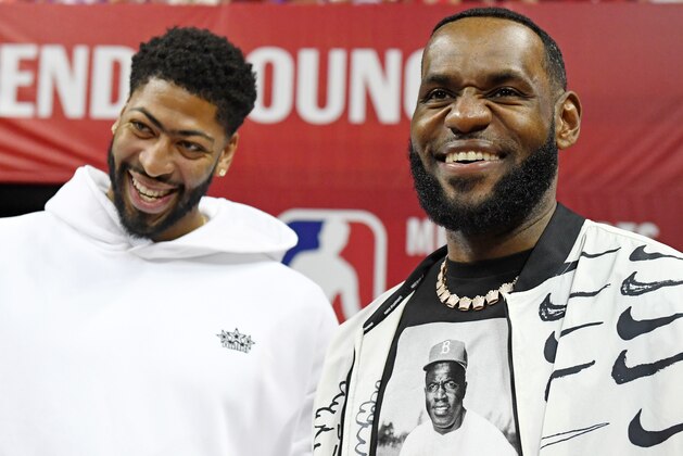 LAS VEGAS, NEVADA - JULY 06:  Anthony Davis (L) and LeBron James of the Los Angeles Lakers arrive at a game between the Lakers and the LA Clippers during the 2019 NBA Summer League at the Thomas & Mack Center on July 6, 2019 in Las Vegas, Nevada. NOTE TO USER: User expressly acknowledges and agrees that, by downloading and or using this photograph, User is consenting to the terms and conditions of the Getty Images License Agreement.  (Photo by Ethan Miller/Getty Images)