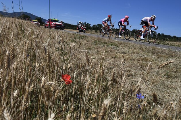 Belgium's Tim Wellens (R), wearing the best climber's polka dot jersey leads a breakaway with two riders during the fifth stage of the 106th edition of the Tour de France cycling race between Saint-Die-des-Vosges and Colmar, in Saint-Die-des-Vosges, eastern France, on July 10, 2019. (Photo by JEFF PACHOUD / AFP)        (Photo credit should read JEFF PACHOUD/AFP/Getty Images)