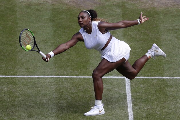 United States' Serena Williams returns to Czech Republic's Barbora Strycova during a women's singles semifinal match on day ten of the Wimbledon Tennis Championships in London, Thursday, July 11, 2019. (AP Photo/Alastair Grant)