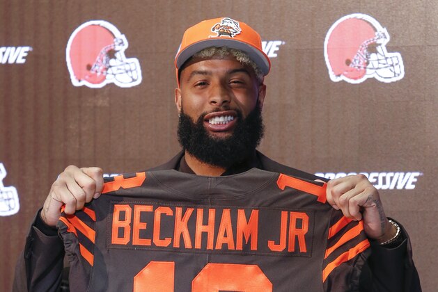 Cleveland Browns' Odell Beckham poses with his jersey during a news conference Monday, April 1, 2019, in Berea, Ohio. (AP Photo/Ron Schwane)