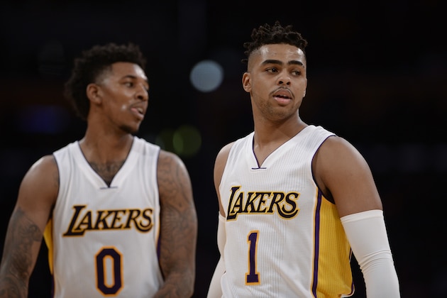 Los Angeles Lakers guard Nick Young (0) and teammate guard D'Angelo Russell (1) during the first half of an NBA basketball game against the New York Knicks, Sunday, Dec. 11, 2016, in Los Angeles.(AP Photo/Gus Ruelas)