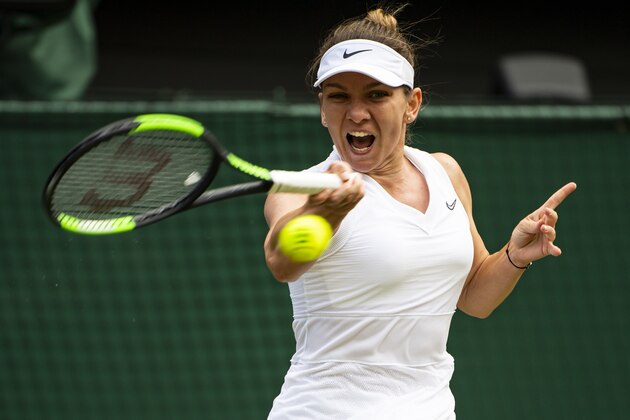LONDON, ENGLAND - JULY 11: Simona Halep of Romania hits a forehand against Elina Svitolina of Ukraine during Day 10 of The Championships - Wimbledon 2019 at All England Lawn Tennis and Croquet Club on July 11, 2019 in London, England. (Photo by TPN/Getty Images)