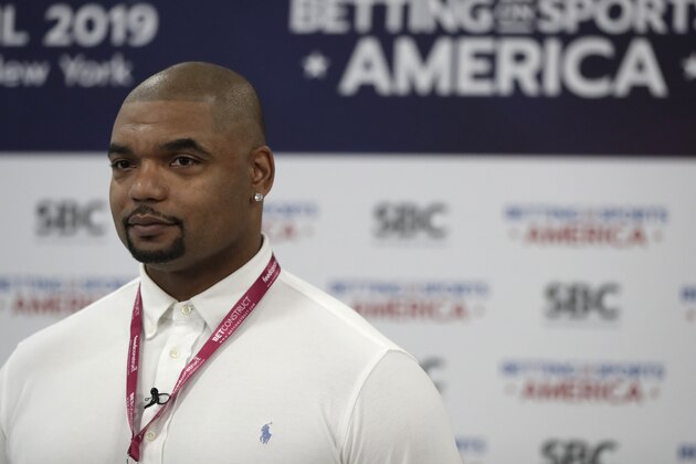 Richard Seymour, former NFL football defensive tackle who played for the New England Patriots and Oakland Raiders, is interviewed during the Betting On Sports America conference, Thursday, April 25, 2019, in Secaucus, N.J. (AP Photo/Julio Cortez)