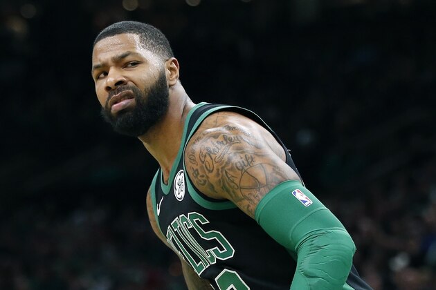 Boston Celtics' Marcus Morris reacts after making a shot during the first half of an NBA basketball game against the Charlotte Hornets in Boston, Sunday, Dec. 23, 2018. (AP Photo/Michael Dwyer)