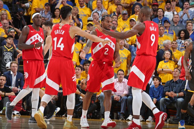OAKLAND, CA - JUNE 13: Danny Green #13 Serge Ibaka #9 and Kawhi Leonard #2 of the Toronto Raptors high five against the Golden State Warriors during Game Six of the 2019 NBA Finals on June 13, 2019 at ORACLE Arena in Oakland, California. NOTE TO USER: User expressly acknowledges and agrees that, by downloading and/or using this photograph, user is consenting to the terms and conditions of Getty Images License Agreement. Mandatory Copyright Notice: Copyright 2019 NBAE (Photo by Nathaniel S. Butler/NBAE via Getty Images)