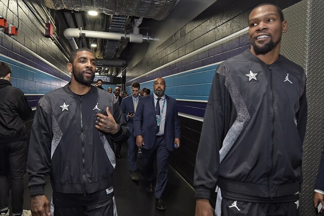 CHARLOTTE, NC - FEBRUARY 17: Kyrie Irving #11 and Kevin Durant #35 of Team LeBron are seen before the game against Team Giannis during the 2019 NBA All-Star Game on February 17, 2019 at Spectrum Center in Charlotte, North Carolina. NOTE TO USER: User expressly acknowledges and agrees that, by downloading and or using this photograph, User is consenting to the terms and conditions of the Getty Images License Agreement. Mandatory Copyright Notice: Copyright 2019 NBAE (Photo by Tom O'Connor/NBAE via Getty Images)