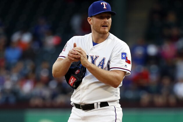 Texas Rangers' Shelby Miller (19) stands on the mound during a baseball game against the Houston Astros in Arlington, Texas, Tuesday, April 2, 2019. (AP Photo/Tony Gutierrez)