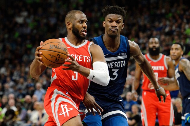 MINNEAPOLIS, MN - APRIL 23: Chris Paul #3 of the Houston Rockets drives to the basket against Jimmy Butler #23 of the Minnesota Timberwolves in Game Four of Round One of the 2018 NBA Playoffs on April 23, 2018 at the Target Center in Minneapolis, Minnesota. The Rockets defeated the Timberwolves 119-100. NOTE TO USER: User expressly acknowledges and agrees that, by downloading and or using this Photograph, user is consenting to the terms and conditions of the Getty Images License Agreement. (Photo by Hannah Foslien/Getty Images)