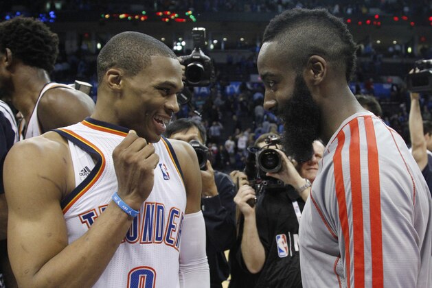 Oklahoma City Thunder guard Russell Westbrook (0) and Houston Rockets guard James Harden, right, talk following their an NBA basketball game in Oklahoma City, Wednesday, Nov. 28, 2012. Oklahoma City won 120-98. (AP Photo/Sue Ogrocki)