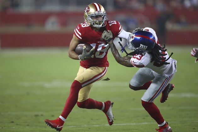 San Francisco 49ers wide receiver Dante Pettis (18) stiff arms New York Giants cornerback B.W. Webb (23) during the first half of an NFL football game in Santa Clara, Calif., Monday, Nov. 12, 2018. (AP Photo/Ben Margot)